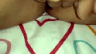 In the quiet room, a JAPANESE beauty gets her ASIAN pussy FINGERED deeply by skilled hands.