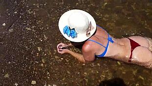 In the water of the Volga River, enjoying a beach day in a bikini.