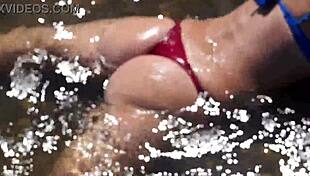 In the water of the Volga River, enjoying a beach day in a bikini.