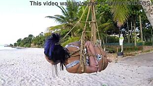 Shibari bondage on public beach with lordshibarifloripa, featuring ripped clothes, natural big tits, and voyeur fetish