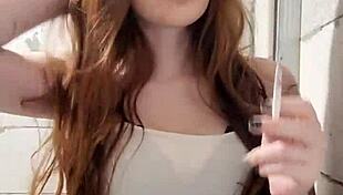 This Redhead Smoker Is Indulging In Her Fetish!