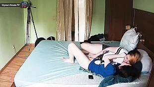 This young chick is getting some intense fingering from her favorite lesbian butch at home