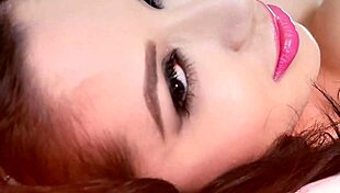 In the office, a bearded guy enjoys titty fucking from a horny brunette with big tits