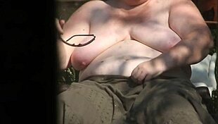 chillin topless in the garden sun