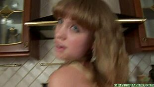 In the kitchen, she uses a dildo toy for an intense solo session.