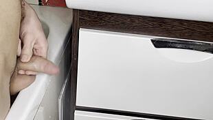 supermdick33 jerks off his shaved cock in the bathroom close up