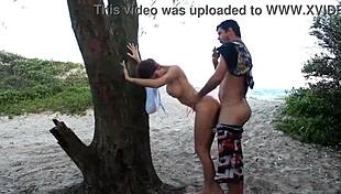 Redhead teen shows natural tits and big cock action on Mariópolis beach in Osório.