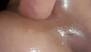 Tight shemale dominates huge dildo