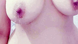 Big tits and boobs dripping water in cumshot scene.