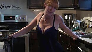 Cute Redhead Dances to French Song La Bohème in Kitchen