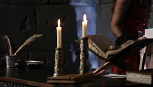 in a medieval fantasy, this teen girl writes a letter while masturbating in sexy cosplay