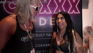 mia mor chats at miami exxxotica 2022 at the coxxx models booth
