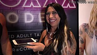 mia mor chats at miami exxxotica 2022 at the coxxx models booth