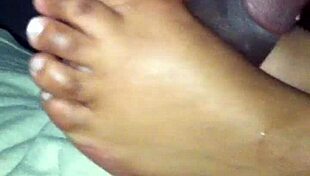 ebony babe gives suggestive footjob to amateur
