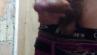 Tattooed skinny tall twink pulls out his dick and masturbates it