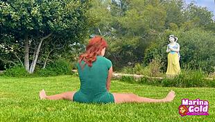 Redhead stretches flexibly in tight dress yoga outdoors, teasing with cameltoe!
