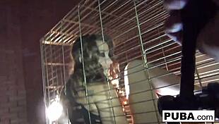 sexy dani daniels trapped in dog cage masturbating. her big tits and pussy on display
