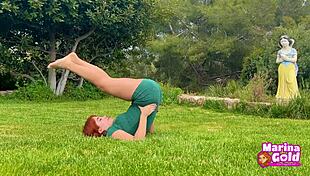 Redhead stretches flexibly in tight dress yoga outdoors, teasing with cameltoe!