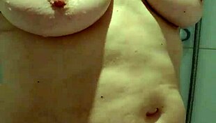 Housewife enjoys intense bathing in hotel shower