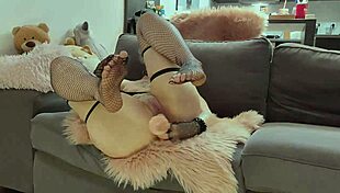 Cute petite teen intensely fucks herself with dildo on sofa