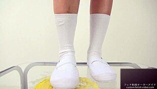 Asian Girl Crushes Banana With Feet