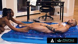 Nuru Massage - Ebony Masseuse Assists Client With Deep Tissue Work