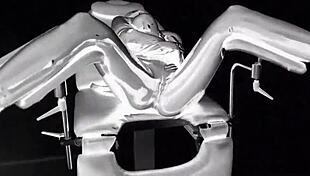 Latex Catsuit In Medical Chair