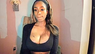 this tattooed ebony milf with big tits is fingering her pussy