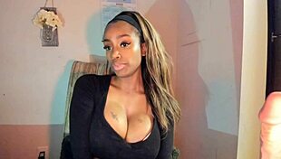 this tattooed ebony milf with big tits is fingering her pussy