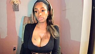 this tattooed ebony milf with big tits is fingering her pussy