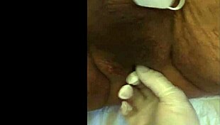 she experiences intense fisting with electrodes in a fetish session