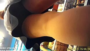 hidden camera captures asian woman's skirt lifted in candid upskirt moment