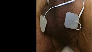 she experiences intense fisting with electrodes in a fetish session