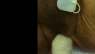 she experiences intense fisting with electrodes in a fetish session