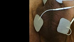 she experiences intense fisting with electrodes in a fetish session