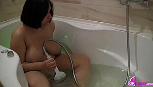 Plump Lady Masturbates with Shower Head by Pool