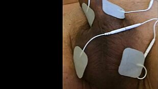 she experiences intense fisting with electrodes in a fetish session