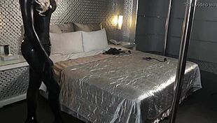 Fuck doll bound in latex and leather