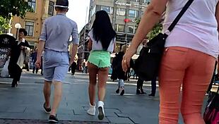 Hot girl with booty shorts walking on the street?