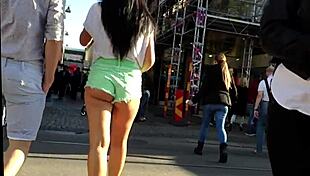 Hot girl with booty shorts walking on the street?