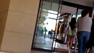 Tight shorts enticing woman making her way down the road