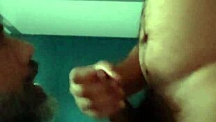 the guy kneels down, starts sucking cock eagerly, waiting for that hot cum