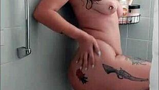 i'm a tattooed brunette masturbating with dildo in bathtub