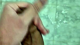 Twink enjoys solo jerking and cumming in steamy bathroom