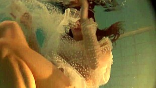 Russian babe Natalia swims and strips nude.