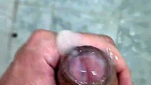 Twink enjoys solo jerking and cumming in steamy bathroom