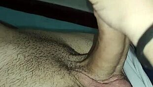 She gives a slow, hot handjob to his big cock!