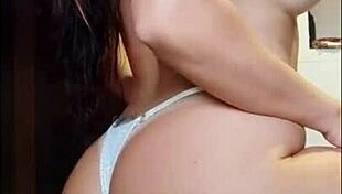In a friends video an athletic redhead seduces with her sensual curves