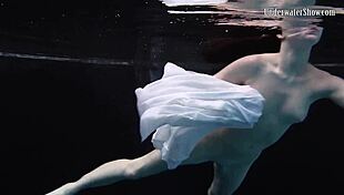 andrejka stuns with incredible underwater moves. her wet body glides effortlessly in the pool.