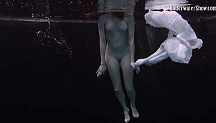 andrejka stuns with incredible underwater moves. her wet body glides effortlessly in the pool.